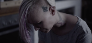 Young tattooed woman in the film ColourBleed